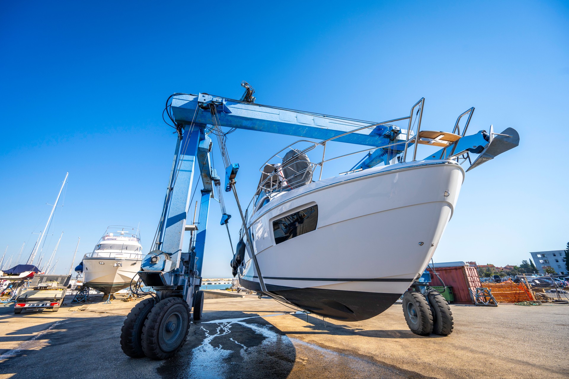 Boat wheel crane elevating motorboat