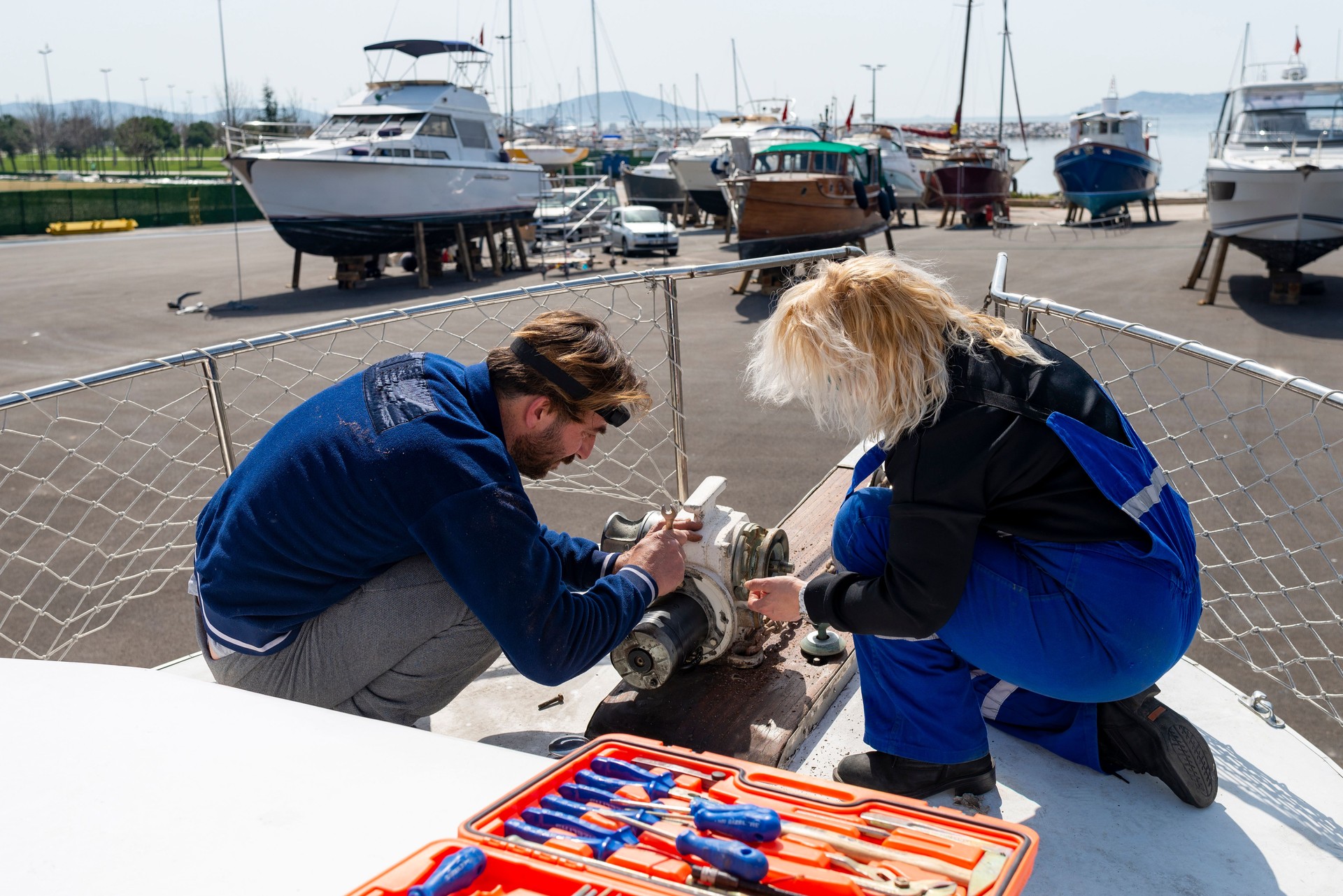 Men and women masters repairing boats.