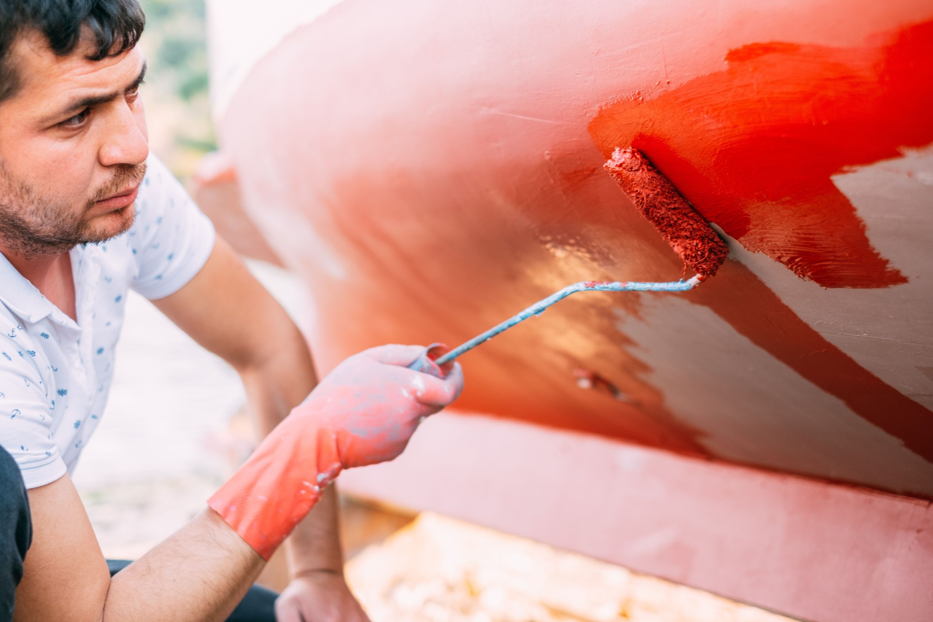 Man Painting His Boat